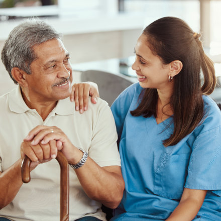 caregiver and senior smiling