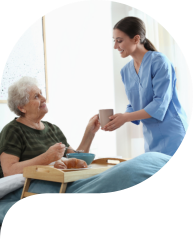 caregiver assisting a senior woman