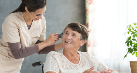 caregiver combing senior