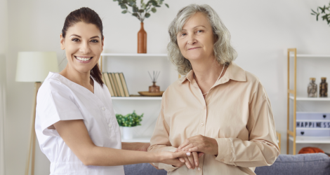 caregiver and senior smiling