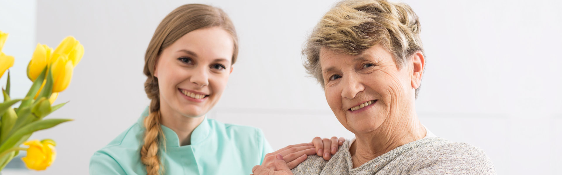 caregiver and senior smiling