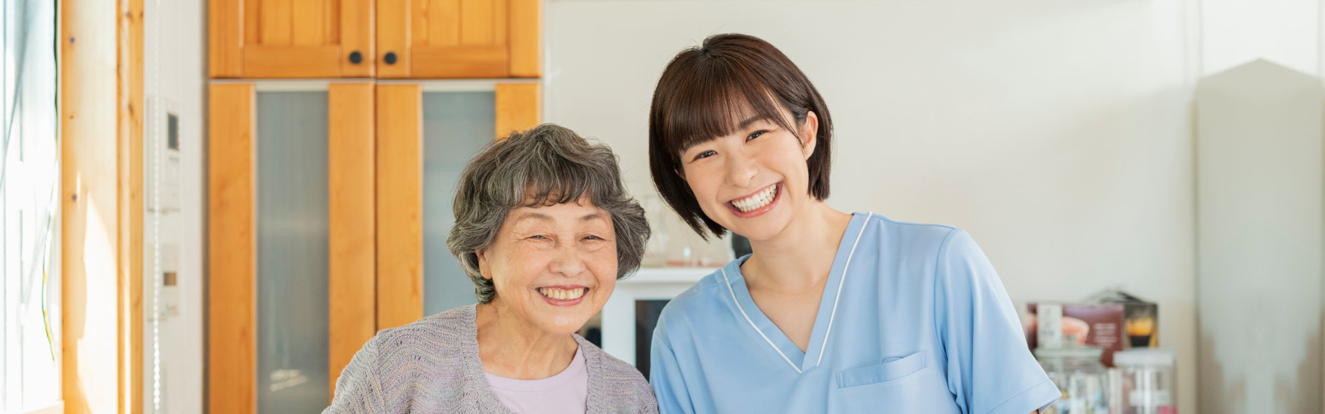 caregiver and senior smiling