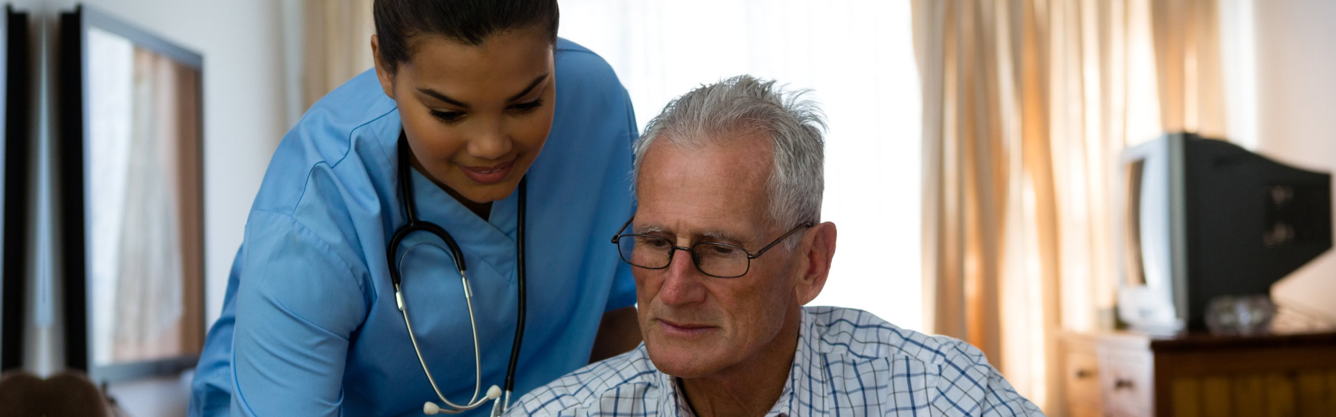 caregiver assisting senior
